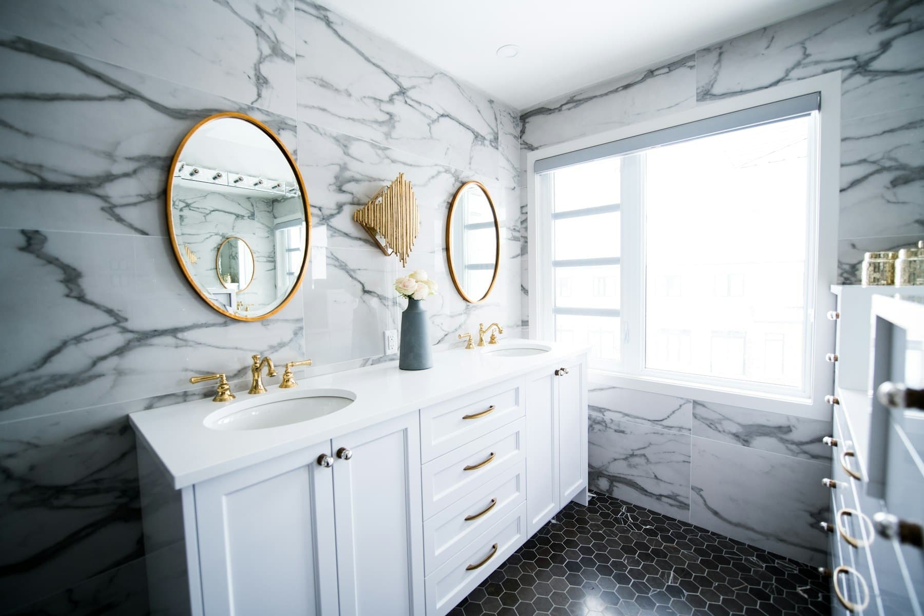 Marble upper hall bath with twin vanities
