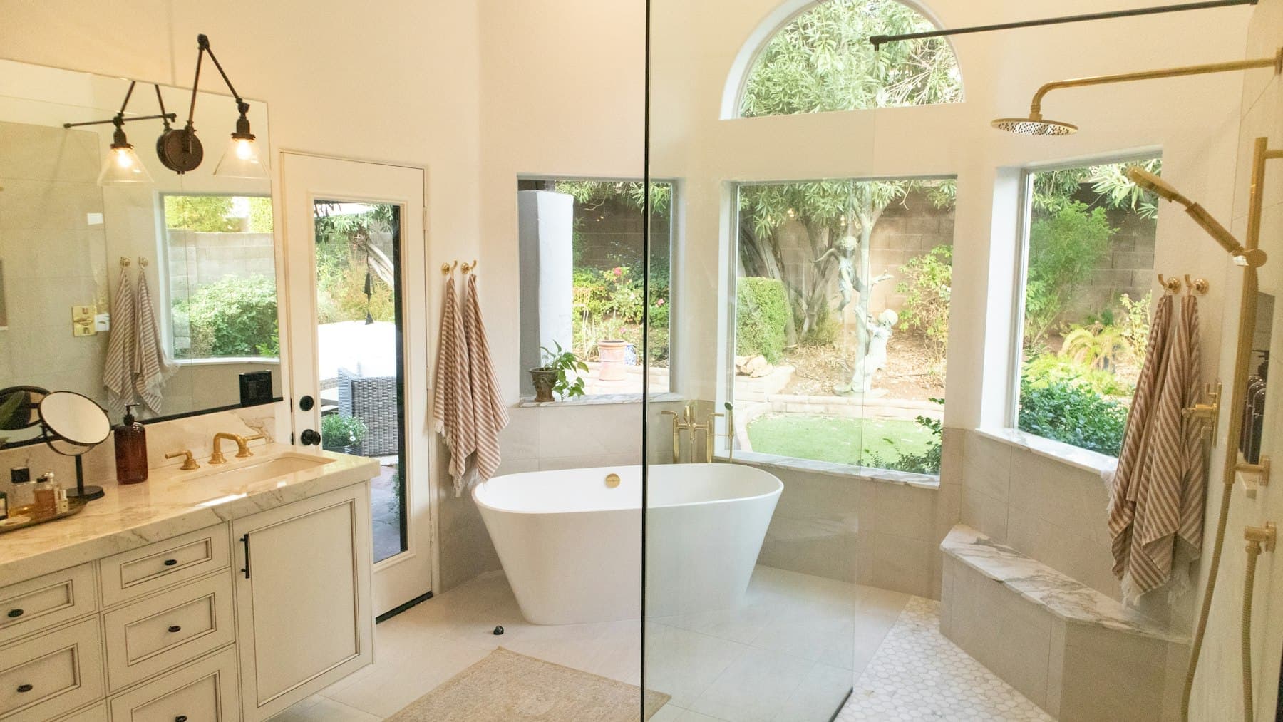 Lower-level bath with a tub looking out to the ravine