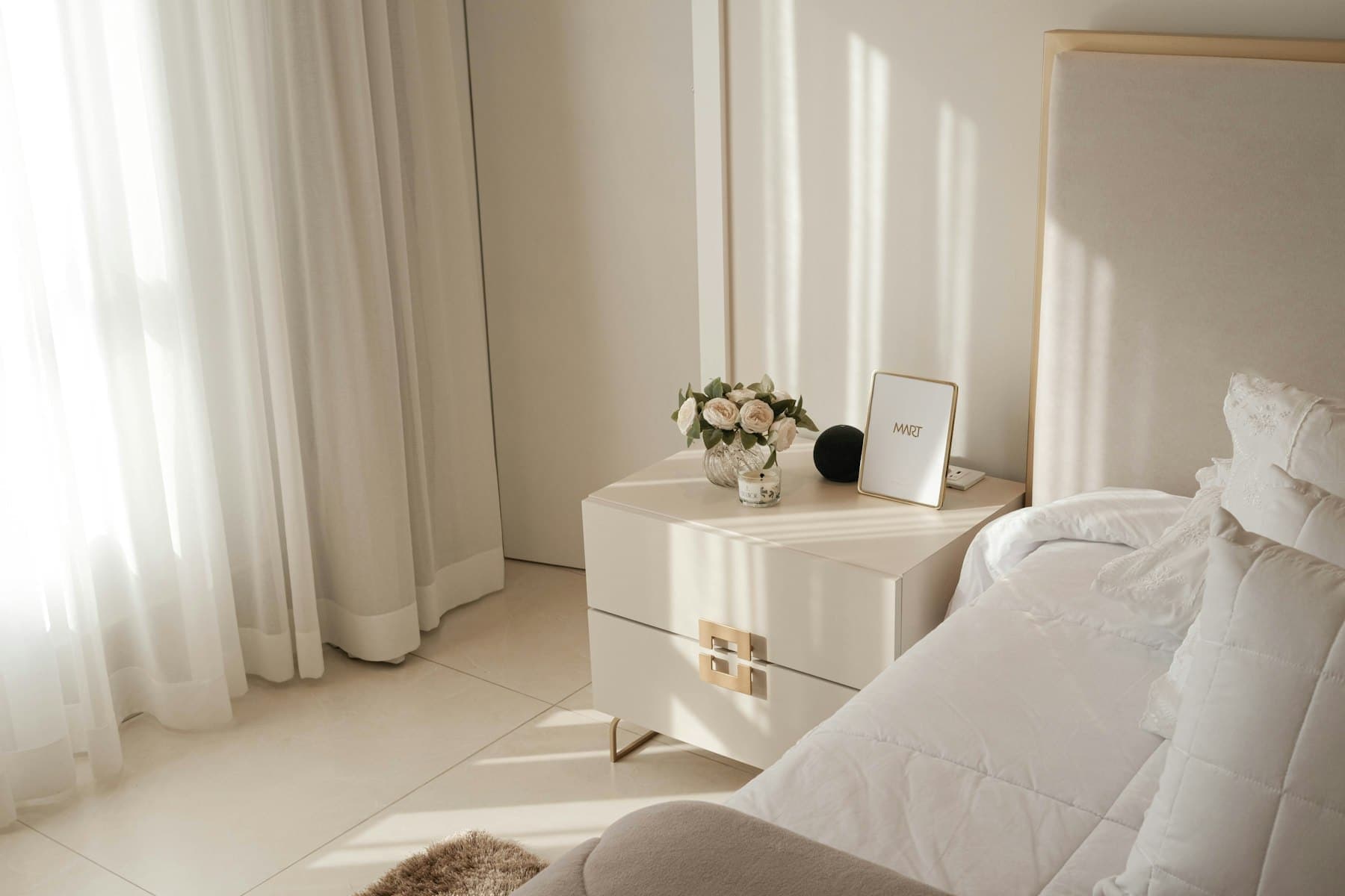 Upper-level king bedroom in soft white linen