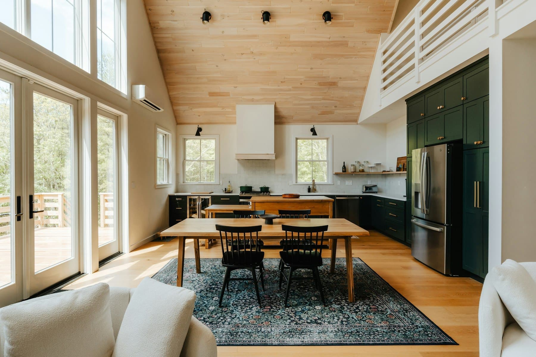 Dining nook off the kitchen under a wood ceiling