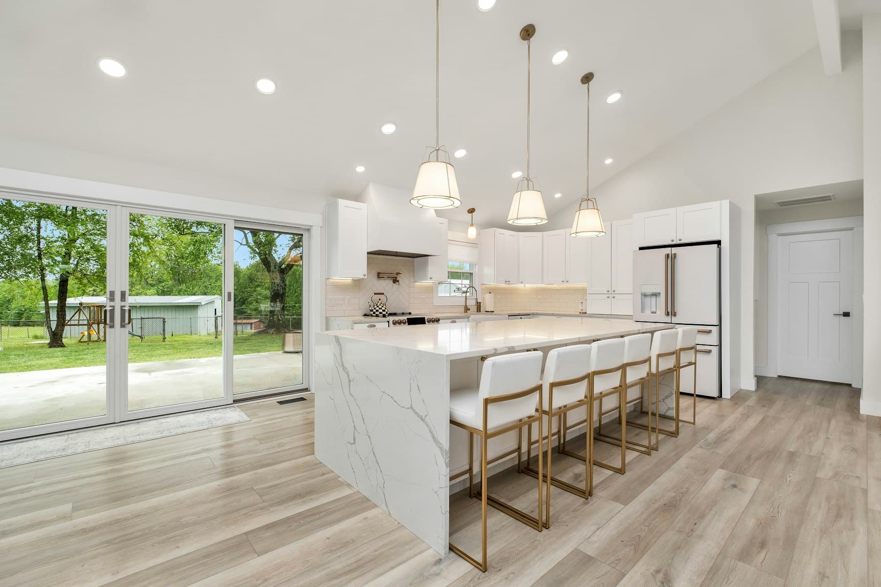 Range wall and prep counter under the vaulted ceiling
