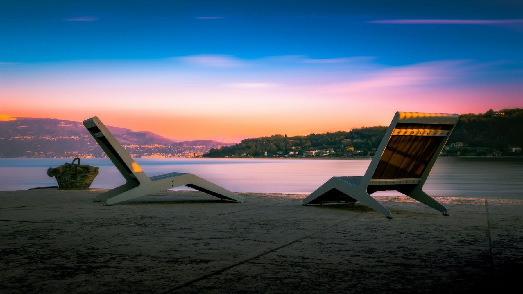 Loungers on the beach at sunset